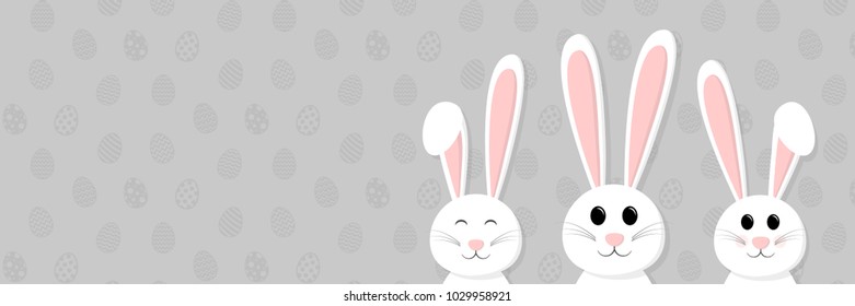 Smiley bunnies on background with eggs and copyspace. Easter concept. Vector.