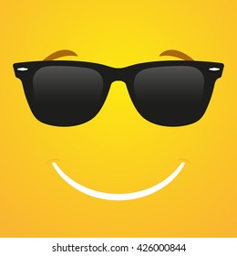 Smiley emoticon in sunglasses  on a yellow background