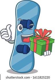 Smiley snowboard in character with gift box