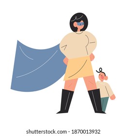 Smiling active young mother in superhero costume standing ready to defend little son