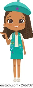 Smiling African American girl scout wearing vest with badges isolated on white background. Junior ligue Scout Girls troop