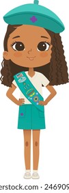 Smiling African American girl scout wearing sash with badges isolated on white background. Junior ligue Scout Girls troop