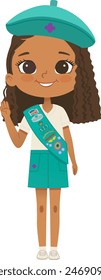 Smiling African American girl scout wearing sash with badges isolated on white background. Junior ligue Scout Girls troop