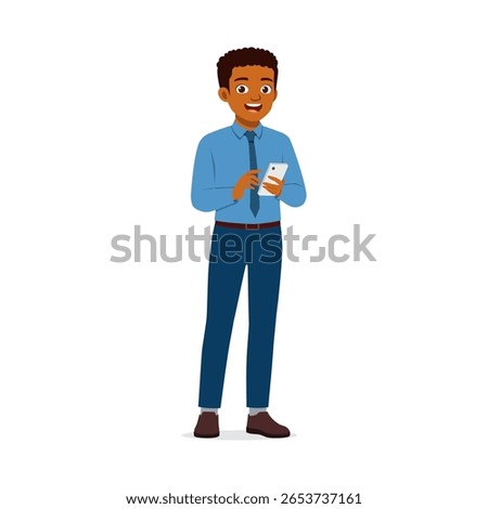 Smiling African American man in formal attire using a mobile phone standing isolated
