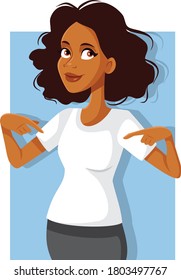 Smiling African Woman Pointing to Blank White Shirt. Casual female promoter modeling and showing off a garment
