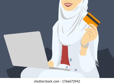 Smiling arabic woman in headscarf using laptop and credit card at home for shopping, paying for utilities online, buying clothes, free space