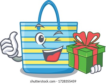 Smiling beach bag cartoon character having a green gift box