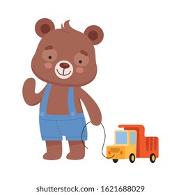 Smiling Bear Character Wearing Playsuit Pulling Toy Truck by the Rope Vector Illustration