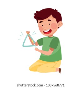 Smiling Boy Character Sitting and Playing Triangle Vector Illustration