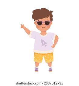 Smiling Boy Character in Sunglasses Pointing at Something with His Finger Vector Illustration