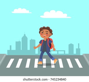 Smiling boy at crosswalk on urban city background. Schoolboy with backpack on pedestrian hurry to school. Right way to pass the street