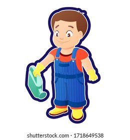 Smiling boy dressed in a shirt, denim overall, watertight boots and gloves holds a watering can in the right hand. Concept of a child helping out with the work around the house or in the garden.