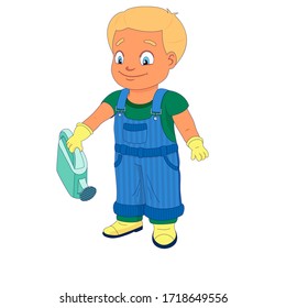 Smiling boy dressed in a shirt, denim overall, watertight boots and gloves holds a watering can in the right hand. Concept of a child helping out with the work around the house or in the garden.