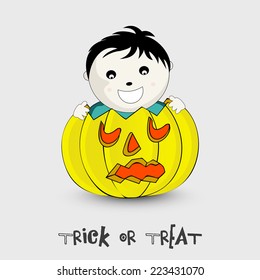 Smiling boy face with scary pumpkin for Halloween celebration and stylish Trick Or Treat Text on light grey background. 