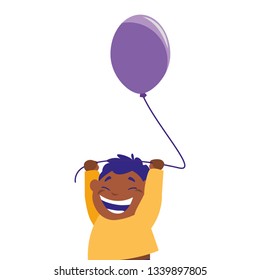 smiling boy holding balloon