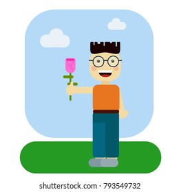 Smiling boy holding flowers