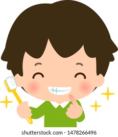 Smiling boy holding a toothbrush