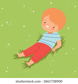 Smiling Boy Lying Down on Green Lawn, Cute Kid Having Fun Outdoors Cartoon Vector Illustration