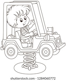 Smiling boy on a toy car swing on a playground, black and white vector illustration in a cartoon style for a coloring book