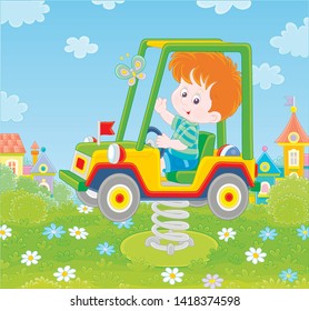 Smiling boy on a toy car swing on a playground in a summer park of a town, vector illustration in a cartoon style