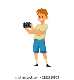 Smiling boy with professional camera taking pictures, flat vector illustration isolated on white background. Cartoon character of cute kid with photography hobby.