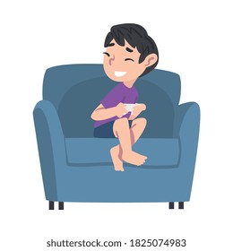 Smiling Boy Sitting on Armchair with Joystick, Teenage Kid Playing Video Computer Game Cartoon Style Vector Illustration