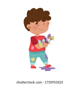 Smiling Boy in Spotted Clothes Carrying Paintbrush and Paints Vector Illustration
