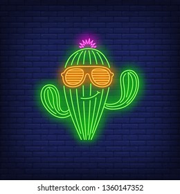 Smiling cactus character wearing sunglasses neon sign. Tourism, vacation, travel, summer design. Night bright neon sign, colorful billboard, light banner. Vector illustration in neon style.