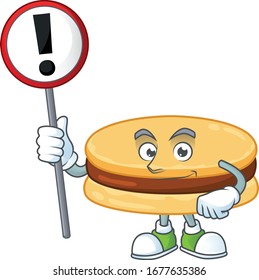 Smiling cartoon design of brown alfajor with a sign