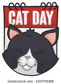Smiling cat over a loose-leaf calendar promoting the celebration of Cat Day.