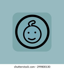 Smiling child face in circle, in square, on pale blue background