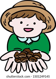 Smiling child picking up chestnuts