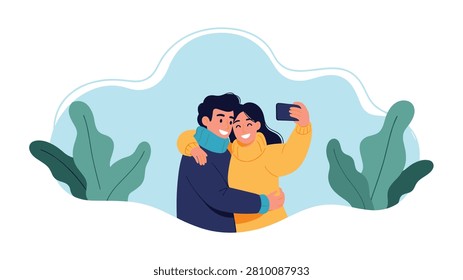 Smiling couple captures a happy memory by taking a selfie with a smartphone while wearing warm sweaters in a stylized garden.