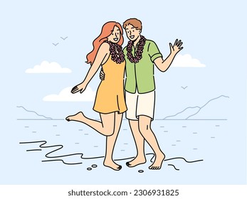 Smiling couple in flower wreaths on neck posing on beach on honeymoon. Happy man and woman enjoy summer vacation on seashore. Vector illustration. 