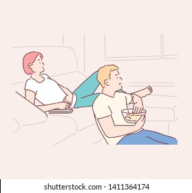 Smiling couple relaxing and watching TV at home, eating popcorn, having rest after hard week. Hand drawn style vector design illustrations. svg