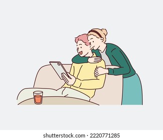 Smiling couple using the tablet pc. Hand drawn style vector design illustrations.