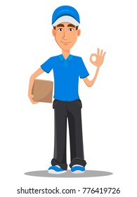 Smiling delivery man in blue uniform holding carton box and showing ok sign. Vector illustration on white background. 