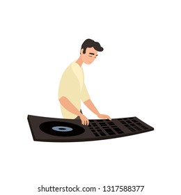 Smiling disk jockey standing sideways plays on turntable on white background