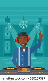 Smiling DJ with console.