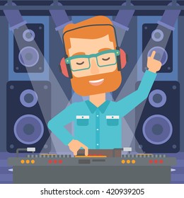 Smiling DJ with console.