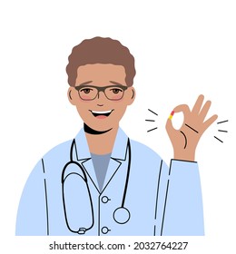 Smiling doctor with glasses holds a pill in his hands. He gestures that everything is fine. Doctor suggests a cure.
