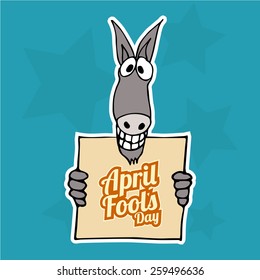 smiling donkey holding a poster fool's day