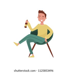 Smiling drunk young man cartoon character, guy sitting in chair with bottle of beer in his hands vector Illustration on a white background