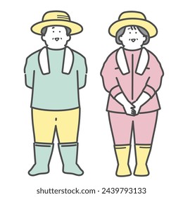 Smiling elderly couple working at a farm