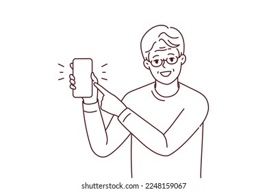 Smiling elderly man in glasses point at mockup cellphone screen. Happy mature grandfather show with finger on smartphone display. Vector illustration. 