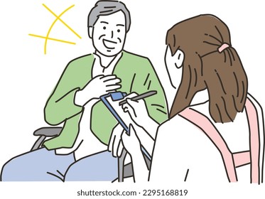Smiling elderly man talking to a caregiver

