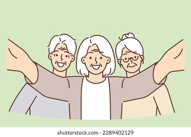 Smiling elderly people posing taking selfie together video active lifestyle and enjoying retirement. Elderly men and women spend time together during meeting of former colleagues or classmates