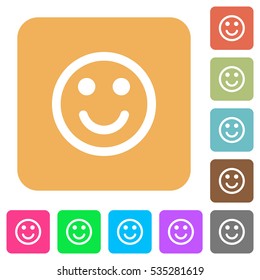 Smiling emoticon icons on rounded square vivid color backgrounds.
