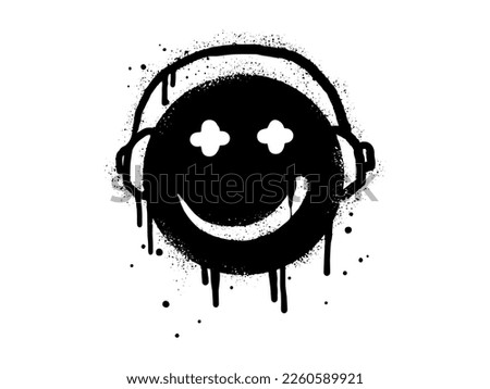 Smiling face emoticon character with headphone. Spray painted graffiti smile face in black over white. isolated on white background. vector illustration