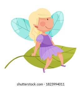 Smiling Fairy or Pixie with Wings Sitting on Leaf Vector Illustration